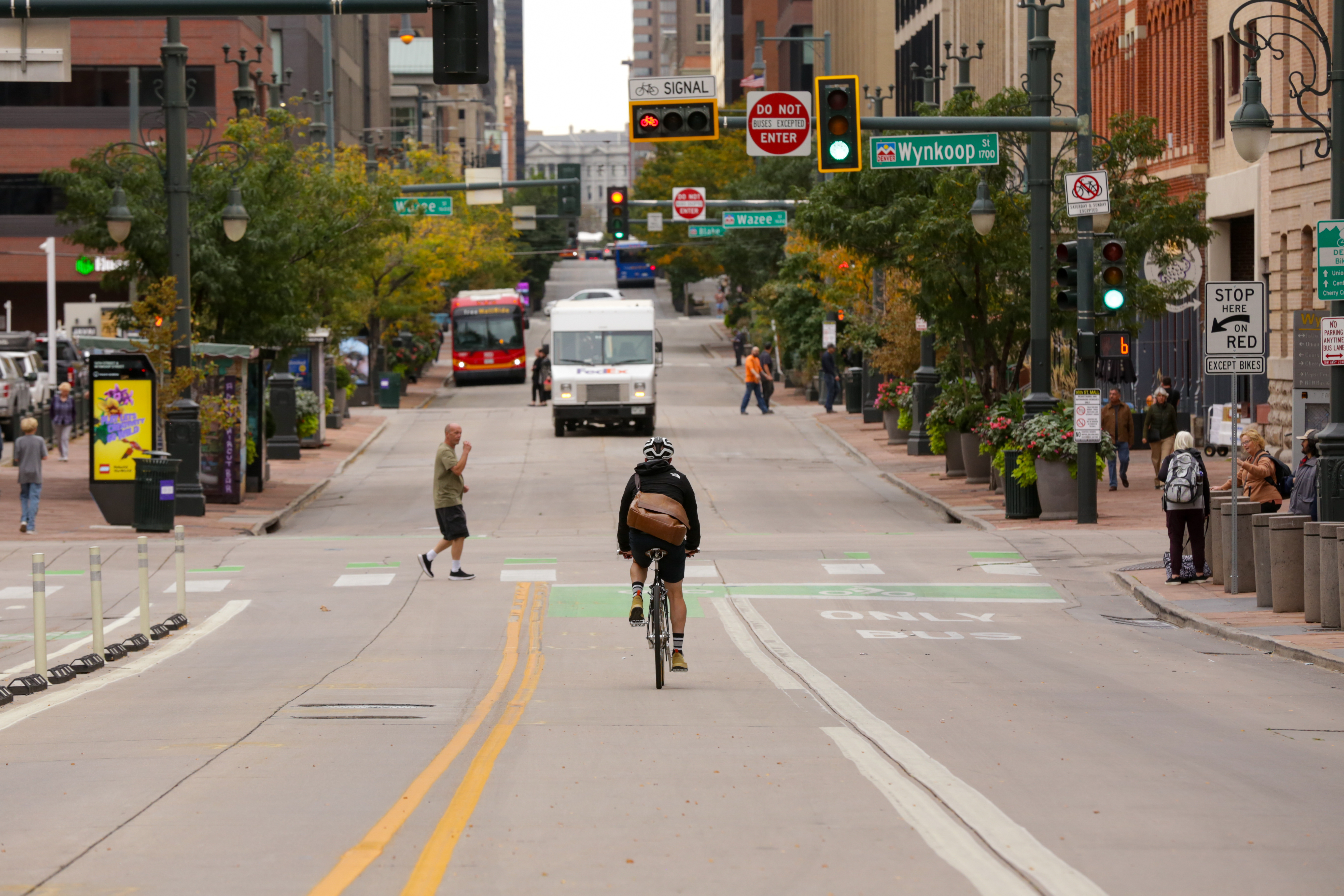 Cyclist riding in a designated bike lane in Denver